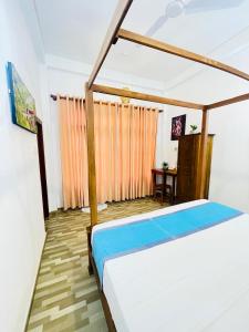 Postel nebo postele na pokoji v ubytování Beach House Ahangama