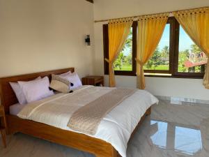 Dira Bungalows客房内的一张或多张床位