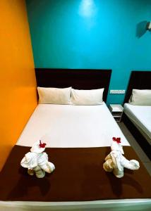 Postel nebo postele na pokoji v ubytování ARK Serendah Hotel