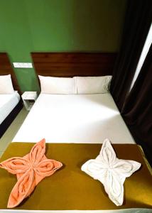 Postel nebo postele na pokoji v ubytování ARK Serendah Hotel