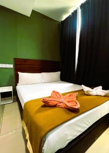 Postel nebo postele na pokoji v ubytování ARK Serendah Hotel