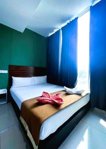 Postel nebo postele na pokoji v ubytování ARK Serendah Hotel