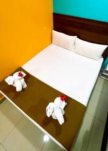 Postel nebo postele na pokoji v ubytování ARK Serendah Hotel
