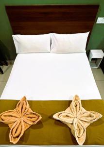 Postel nebo postele na pokoji v ubytování ARK Serendah Hotel