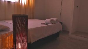 Postel nebo postele na pokoji v ubytování Hostal Viva Mar