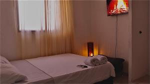 Postel nebo postele na pokoji v ubytování Hostal Viva Mar
