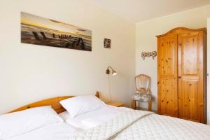 Postel nebo postele na pokoji v ubytování ROD32e "Carpe Diem" Ferienwohnung Schönberg
