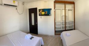 Postel nebo postele na pokoji v ubytování Hostal Viva Mar