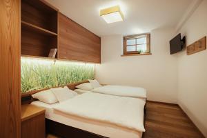 Posteľ alebo postele v izbe v ubytovaní Hotel Grien