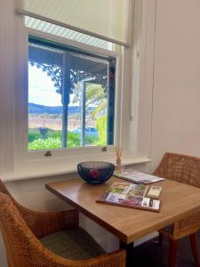 a wooden table with a window and a bowl on it at Pirathon Country Estate in Tanunda