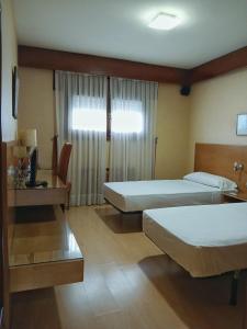 Postel nebo postele na pokoji v ubytování Hostal Los Infantes + 14 fotografií