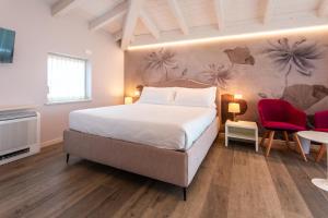 Postel nebo postele na pokoji v ubytování Re Ottone Rooms + 37 fotografií