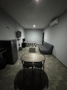 a living room with a table and a couch at Loft en tequila Jalisco in Tequila