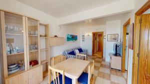a living room with a table and a couch at Holidoo Travel "Casa Mya" in Los Alcázares +7 photos