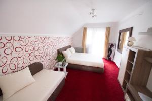 Postel nebo postele na pokoji v ubytování Margo Apartman