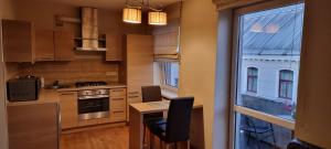 Kuchyň nebo kuchyňský kout v ubytování city center apartment