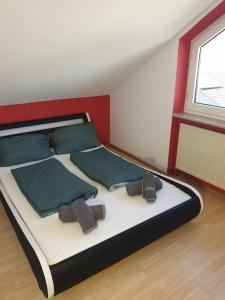 En eller flere senge i et værelse på Schöne Wohnung zentral Ingolstadt