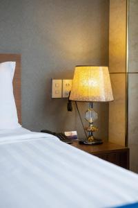 Postel nebo postele na pokoji v ubytování Sandals Hotel