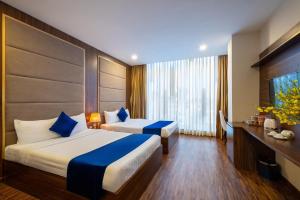 Postel nebo postele na pokoji v ubytování Sandals Hotel