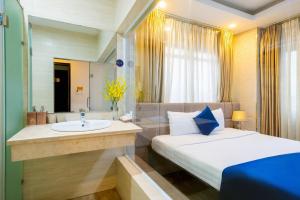 Postel nebo postele na pokoji v ubytování Sandals Hotel
