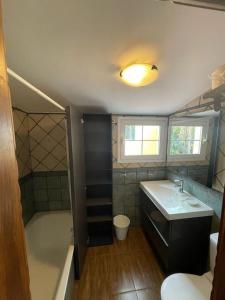 a bathroom with a tub and a sink and a shower at La villa de Simón in Puerto de la Cruz +3 photos