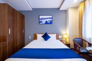 Postel nebo postele na pokoji v ubytování Sandals Hotel