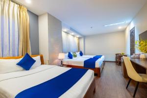 Postel nebo postele na pokoji v ubytování Sandals Hotel