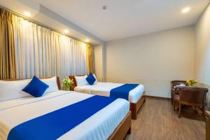 Postel nebo postele na pokoji v ubytování Sandals Hotel