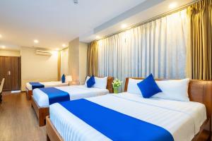 Postel nebo postele na pokoji v ubytování Sandals Hotel