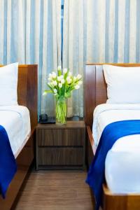 Postel nebo postele na pokoji v ubytování Sandals Hotel