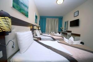 Postel nebo postele na pokoji v ubytování Mariana Hotel