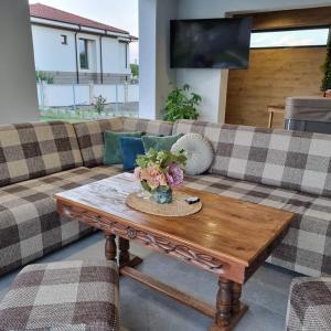 a living room with a couch and a coffee table at Хотел Европа in Montana +29 photos