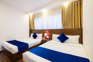 Postel nebo postele na pokoji v ubytování Sandals Hotel