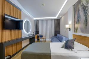 Postel nebo postele na pokoji v ubytování Alba Resort Hotel - Ultra All Inclusive