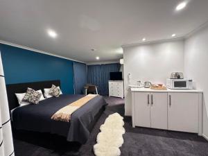A kitchen or kitchenette at Tongariro Suites