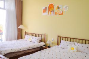Ein Bett oder Betten in einem Zimmer der Unterkunft Mô Tê Homestay 2 gần Chợ Đông Ba, Cung Đình Hoàng Thành Huế