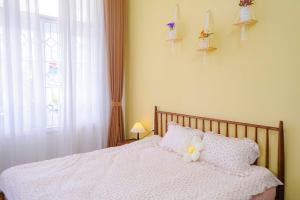 Ein Bett oder Betten in einem Zimmer der Unterkunft Mô Tê Homestay 2 gần Chợ Đông Ba, Cung Đình Hoàng Thành Huế