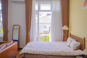 Ein Bett oder Betten in einem Zimmer der Unterkunft Mô Tê Homestay 2 gần Chợ Đông Ba, Cung Đình Hoàng Thành Huế