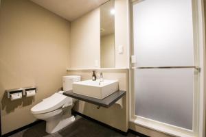 a bathroom with a toilet and a sink and a shower at Hotel GRAN THE PARK II in Hiroshima +34 photos