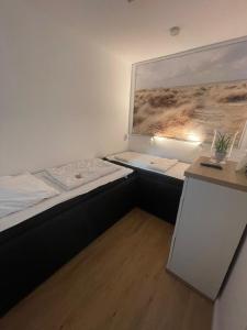 Postel nebo postele na pokoji v ubytování Küstenbude Sonnendeck