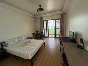 TV a/nebo společenská místnost v ubytování Pango Ocean Blue Hotel