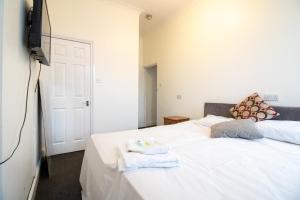 Ένα ή περισσότερα κρεβάτια σε δωμάτιο στο Pebbles guest house room 6