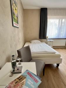 Postel nebo postele na pokoji v ubytování Hotel Hiltruper Hof
