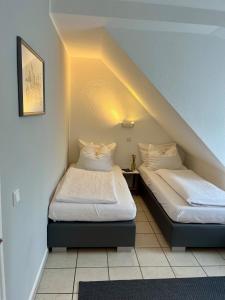 Postel nebo postele na pokoji v ubytování Hotel Hiltruper Hof