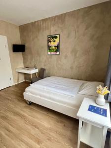 Postel nebo postele na pokoji v ubytování Hotel Hiltruper Hof