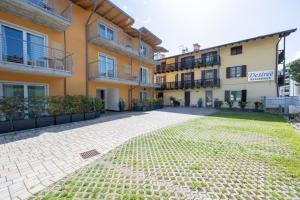 an empty courtyard in front of a building at Residence Desiree in Riva del Garda