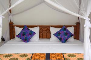 Postel nebo postele na pokoji v ubytování Zanzibar View Hotel