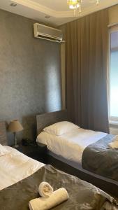A bed or beds in a room at Hotel Old Rustaveli