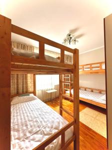 a bedroom with two bunk beds in a house at Amar Guest House in Ulaanbaatar +14 photos