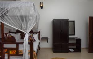 Postel nebo postele na pokoji v ubytování Zanzibar View Hotel